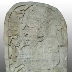 Photo of Machaquilá Stela 2, provided by and used with the permission of MUNAE; the cuts made by looters to render the sculpture into transportable blocks are visible.